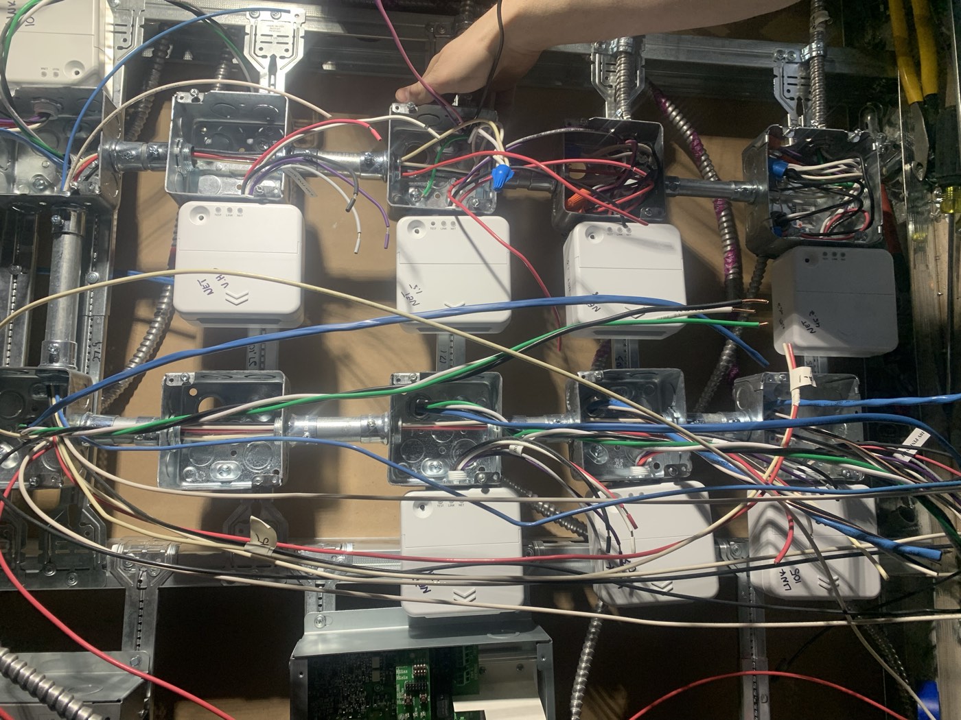 Fire alarm interface modules wired during a commercial life safety rough-in