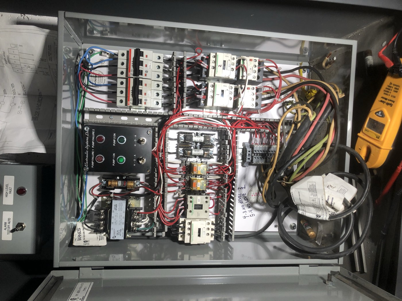 Industrial pump control panel with breakers and contactors