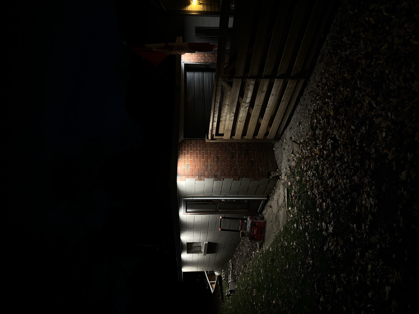 Newly installed exterior soffit lighting illuminating a home at night