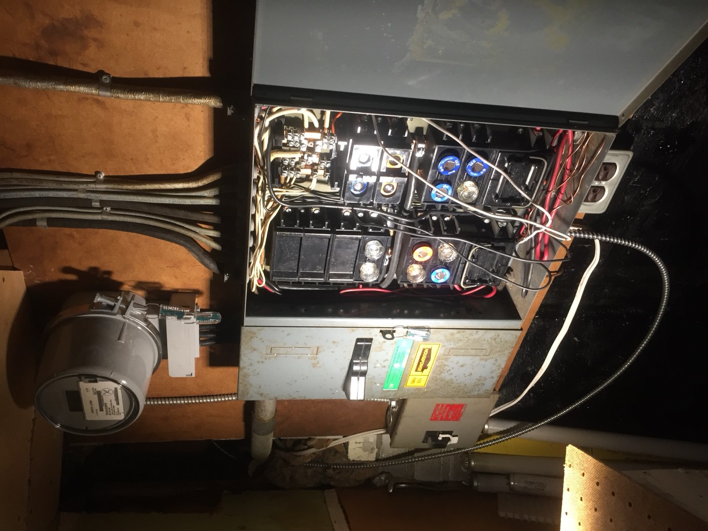 Old fused electrical panel before a service upgrade