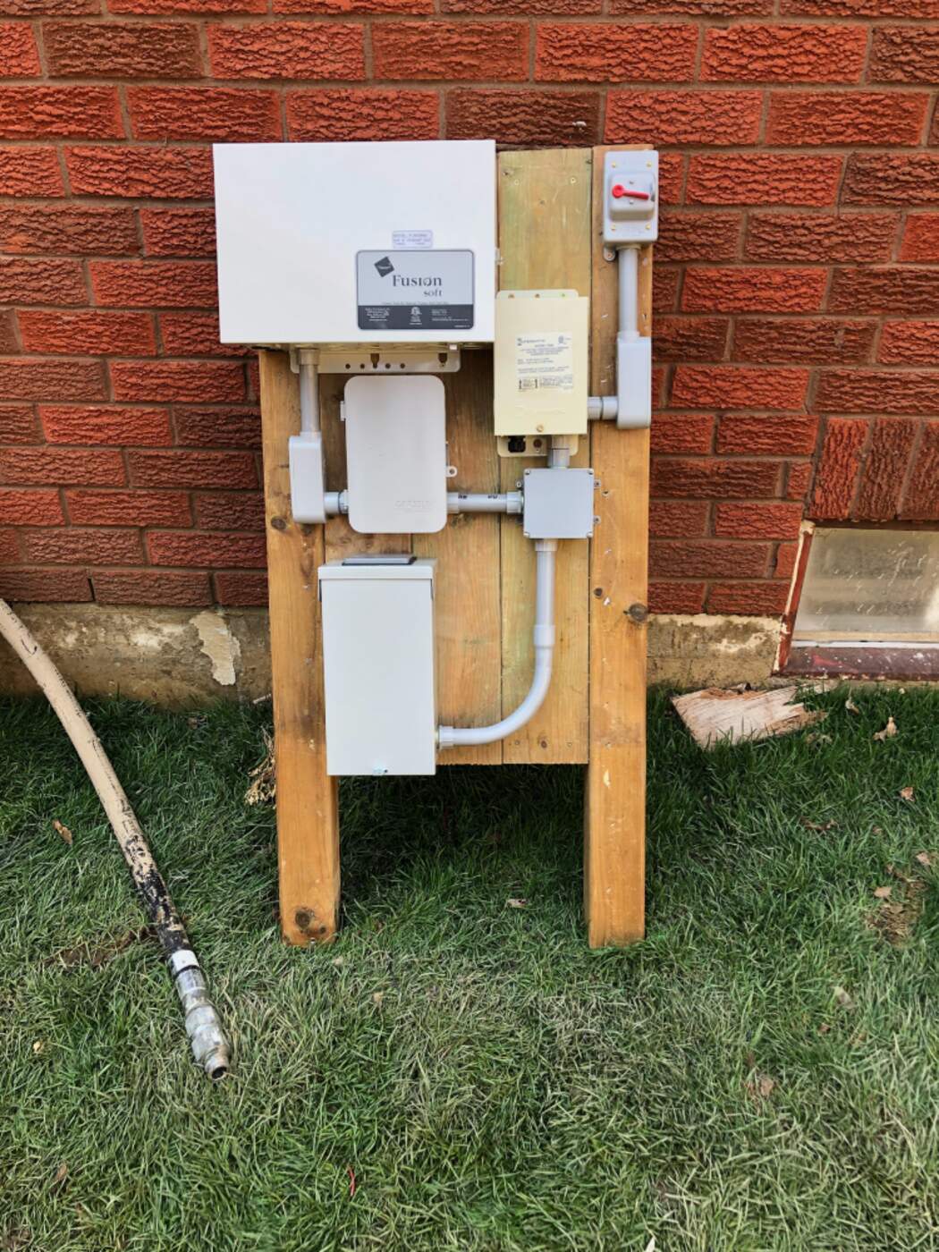 Outdoor water treatment control unit wired with conduit and a disconnect switch